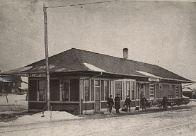 historical black and white photo of train station exterior