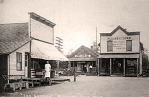 historical black and white photo of two storefronts